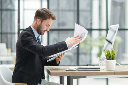 Close Up Of Businessman Taking Folders From Handの写真素材