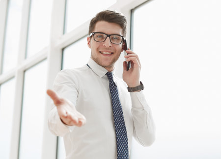 Businessman Making Phone Call In Officeの写真素材