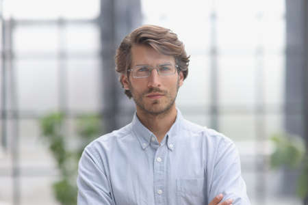 close-up portrait of a young successful businessman in the officeの写真素材