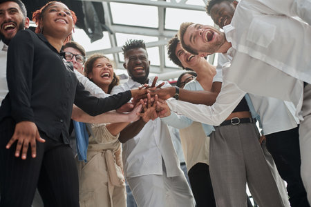 A Group of International Business People Are Putting Their Hands Togetherの写真素材