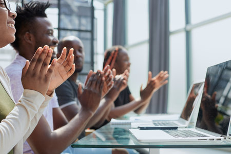 Multi ethnic business group greets somebody with clapping and smiling
