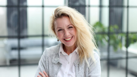 Portrait of a young beautiful business woman in the officeの写真素材