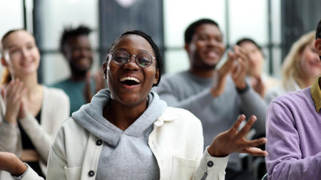 Businessmen attentively listen to the instructor at the lectureの写真素材