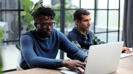african white colleagues working together use pc corporate apps, mentor teach new employeeの写真素材