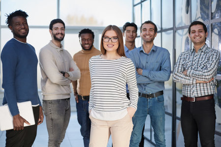 Business people in elegant casual clothes are standing in the office