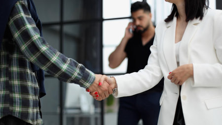 Close-up of two business people shaking hands
