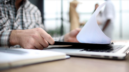 International business team celebrating success and applauding standing in office hallの写真素材