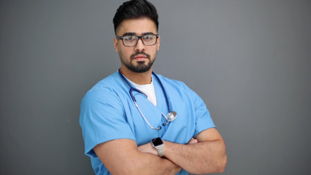 Caucasian male doctor wearing a lab coat with stethoscope,の写真素材