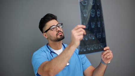 Doctor male looking check up x-ray film in medical laboratory at hospital