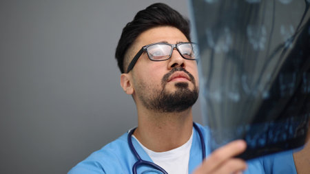 Doctor male looking check up x-ray film in medical laboratory at hospitalの写真素材