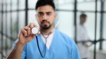 healthcare and medicine - doctor in blue coat holding stethoscopeの写真素材