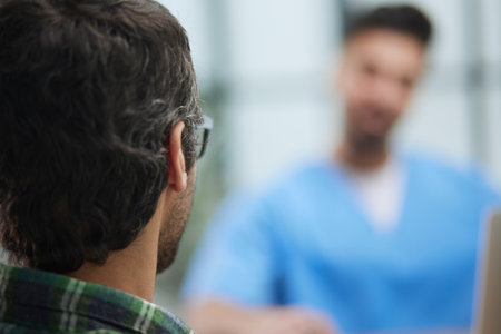 Doctor with patient in medical office at the receptionの写真素材