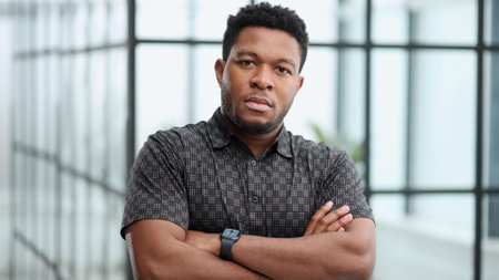 Serious dark skinned businessman has strict lookの写真素材