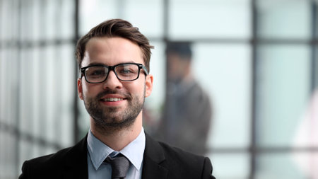 Portrait of a businessman with glasses. Happy man looks at the camera.の写真素材