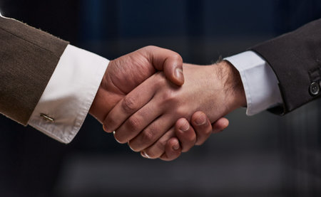 business people handshake over wooden table. businessmen agreement and partnership concept.の写真素材