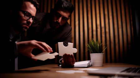 Business teamwork with white puzzle pieces cooperation unity conceptの写真素材
