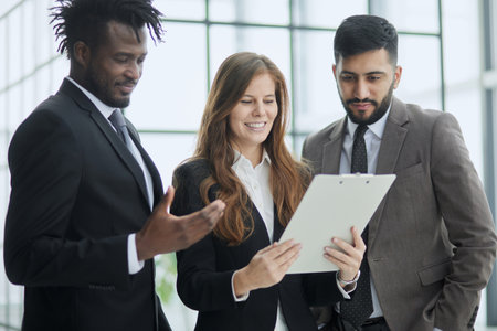 Diverse staff members confident smile business team holding document notepad device