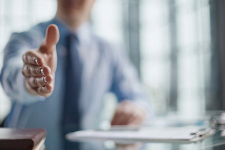 Close up agent reach out hand to camera handshake client.の写真素材