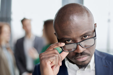 Handsome african american executive businessman in modern officeの写真素材