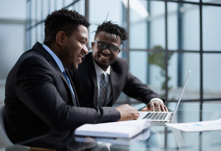 African american boss negotiating discussing contract details with company corporate client.