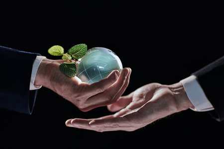 Plabt Growing inside a Sphere - Hand Holding - Eco Conceptの写真素材