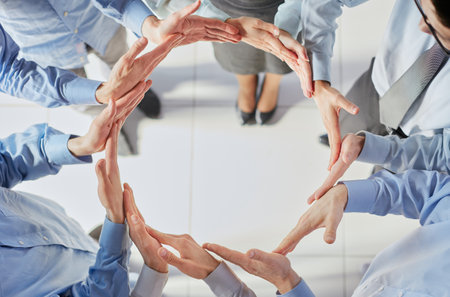 Business people standing together puts palms together making circle