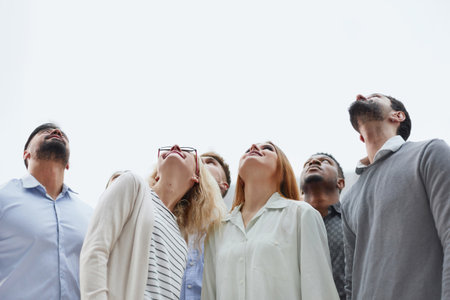 Active multiethnic male and female audience looking upの写真素材