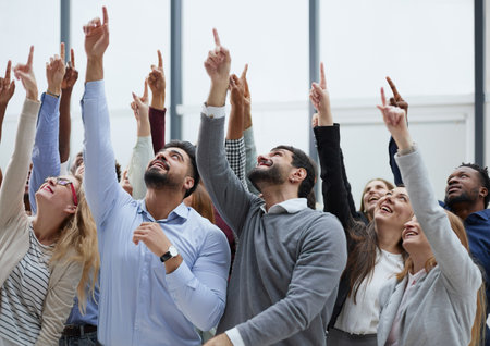 happy group of diverse young people holding their hands upの写真素材