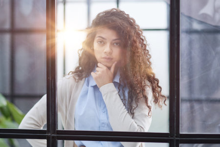 Business woman in the office outside the window