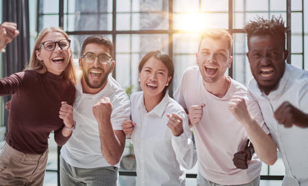 Portrait of successful creative business team looking at camera and smiling.の写真素材