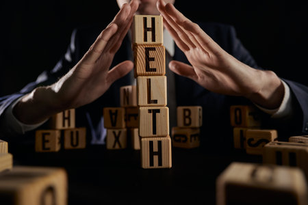 Wooden cube with the word Health, life insurance and healthcareの写真素材