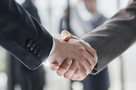 Extreme Closeup of Two Men Shaking Handsの写真素材