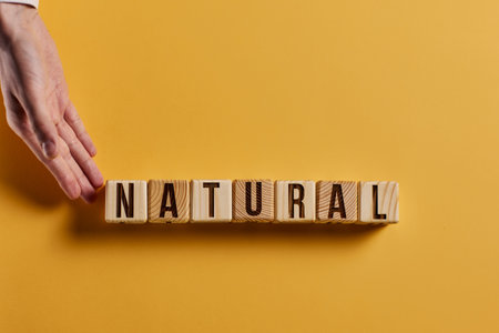 organic word on a blue background written on a wooden block. organic text on the table, concept.の写真素材
