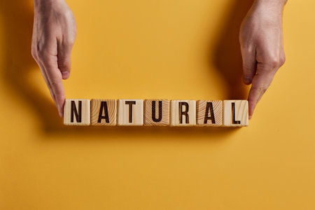 organic word on a blue background written on a wooden block. organic text on the table, concept.の写真素材