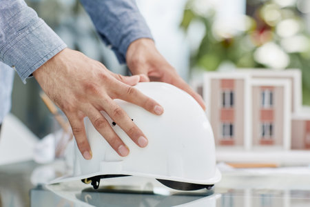 Close up white safety helmet on the tableの写真素材
