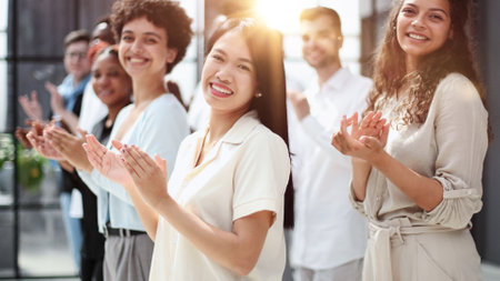 High angle view of multiethnic people cheering after a seminar