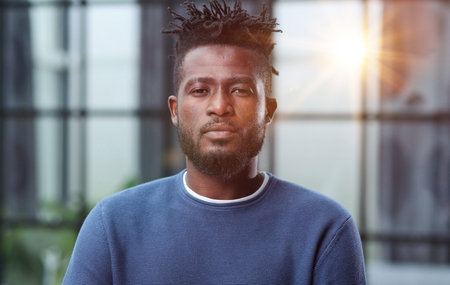 Confident black business man looking at camera with serious expressionの写真素材