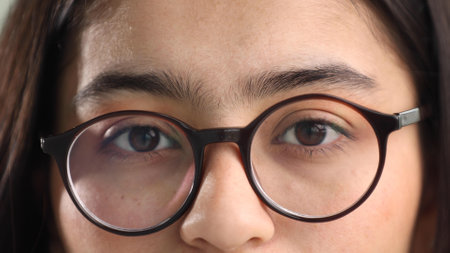 Close-up of closed female eyes in glassesの写真素材