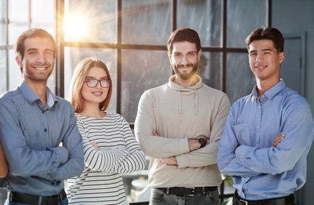 business people standing and looking straight ahead in a modern office