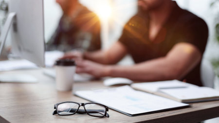 Close-up A businessman working in a private room, He is typing on a laptop keyboard.の写真素材