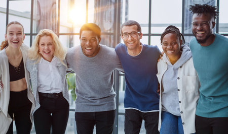 Group of business people standing at the window of a modern office