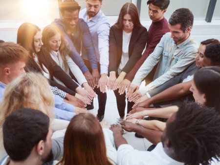 Narrow banner of multiracial people stack hands motivated for shared business success or goal achievement.の写真素材
