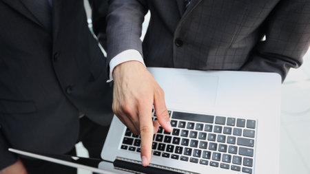 Working on a laptop computer in the officeの写真素材