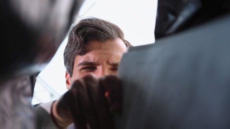 business man takes out a folder from a plastic bag. bottom viewの写真素材