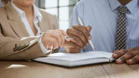 Young account manager advisor lawyer showing paper documents to partner