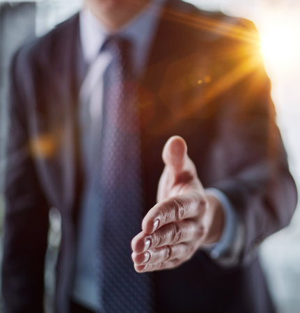 Close up agent reach out hand to camera handshake client.の写真素材
