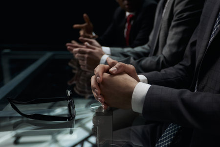 Business partners discuss financial reports, plan an investment strategy. Team of threeの写真素材
