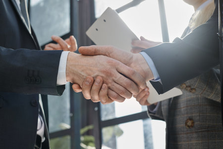confident boss accept handshaking employer getting hired at a new job.の写真素材