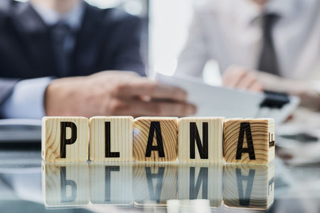 Businessman hand flipping wooden cube blocks with PLAN A change to PLAN Bの写真素材