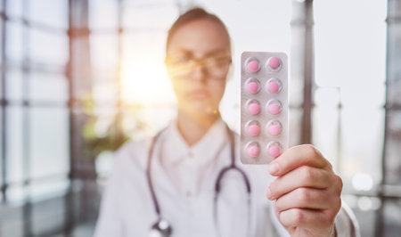 Close up portrait female doctor scientist pharmacist looking at camera presenting new effective pill medicine.の写真素材